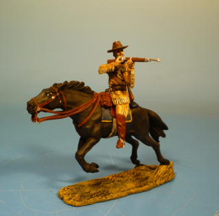 Trapper schieend zu Pferd mit 2 Gewehr auf dem Rcken