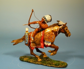 Indianer seitlich am Pferd h�ngend mit Pfeil und Bogen schie�end