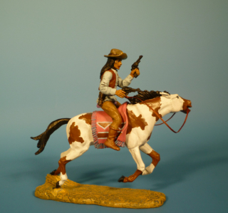 Apache zu Pferd mit Revolvern schieend